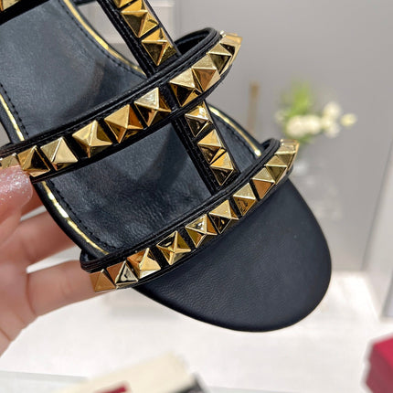 VALENTINO 26S ROCKSTUD STRAPPY FLAT SLIDE SANDALS IN BLACK CALFSKIN GOLD HARDWARE