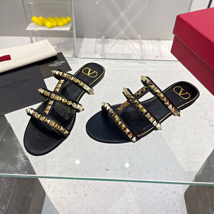 VALENTINO 26S ROCKSTUD STRAPPY FLAT SLIDE SANDALS IN BLACK CALFSKIN GOLD HARDWARE