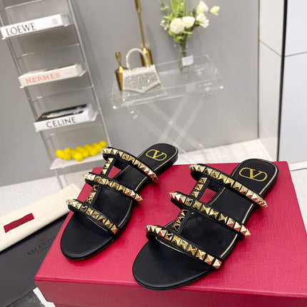 VALENTINO 26S ROCKSTUD STRAPPY FLAT SLIDE SANDALS IN BLACK CALFSKIN GOLD HARDWARE