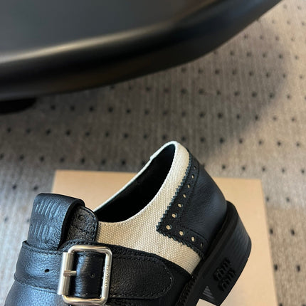 MIUMIU 26S FRINGE BUCKLE LOAFERS IN BLACK CALFSKIN