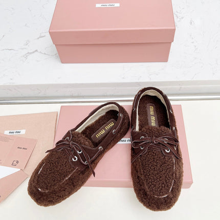 MIUMIU 26S BOAT LOAFERS IN DARK BROWN SHEARLING
