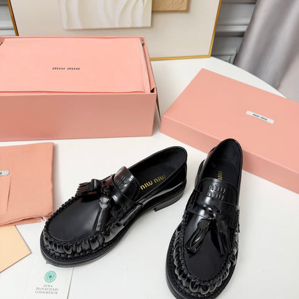 MIUMIU 26S TASSEL LOAFERS IN BLACK CALFSKIN