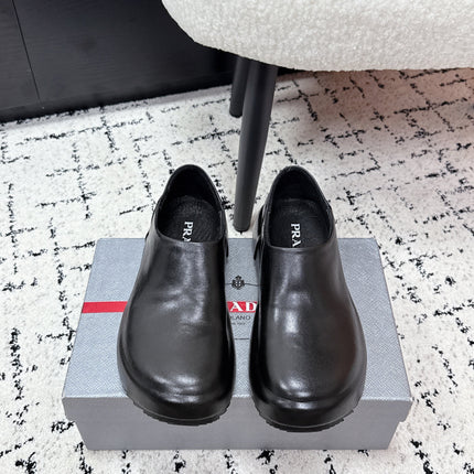 PRADA 26S SLIP ON SHOES IN BLACK SMOOTH CALFSKIN