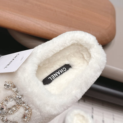 CHANEL 26S MULES IN BLACK AND WHITE SHEARLING WITH ROUND TOE