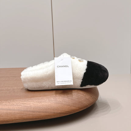 CHANEL 26S MULES IN BLACK AND WHITE SHEARLING WITH ROUND TOE