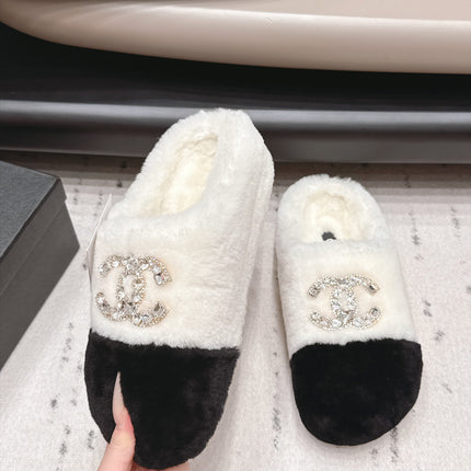 CHANEL 26S MULES IN BLACK AND WHITE SHEARLING WITH ROUND TOE