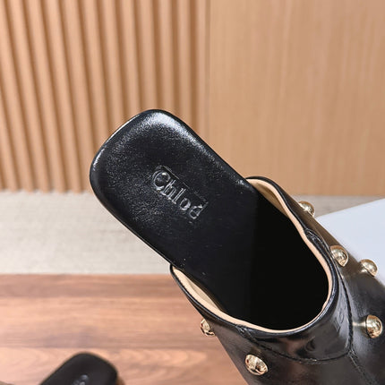 CHLOE 26S STUDDED FLAT MULES IN BLACK CALFSKIN