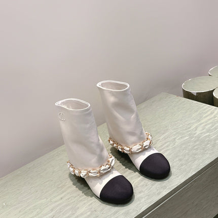 CHANEL 25S CALF-LENGTH BOOTS 45MM IN WHITE AND BLACK CALFSKIN GOLD HARDWARE