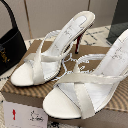 CHRISTIAN LOUBOUTIN 26S CROSS-STRAP HIGH HEEL SANDALS 105 MM IN CREAM WHITE SATIN