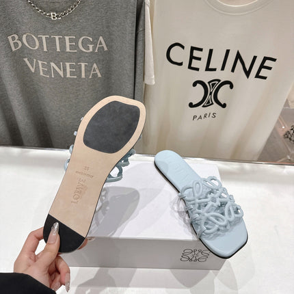 LOEWE 26S PETAL ANAGRAM SLIDE IN LIGHT BLUE CALFSKIN