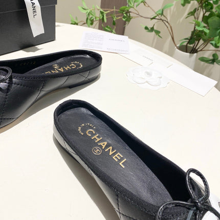 CHANEL 26S FLAT MULES IN BLACK LAMBSKIN