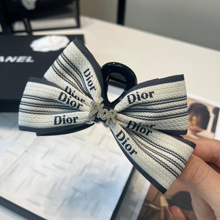 DIOR 26S BOW HAIR CLIP IN WHITE AND BLACK FABRIC 512124