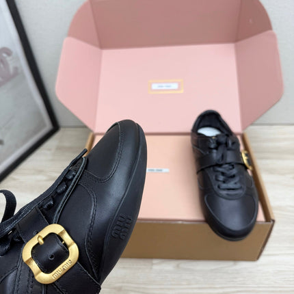 MIUMIU 26S BUCKLE SNEAKERS IN BLACK CALFSKIN WITH GOLD HARDWARE