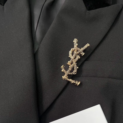 YSL 26S ORNATE TEXTURED MONOGRAM BROOCH IN ANTIQUE GOLD TONE METAL 617587