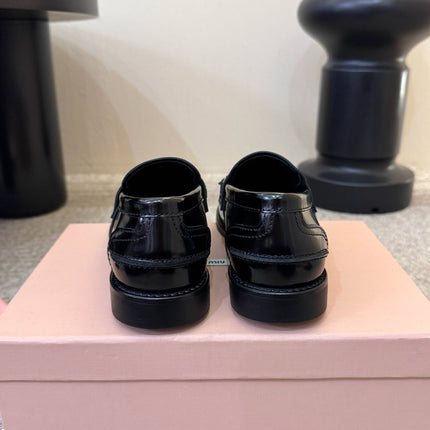MIUMIU 26S FRINGE PENNY LOAFERS IN BLACK CALFSKIN