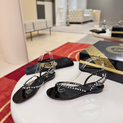 CHRISTIAN LOUBOUTIN 26S STUDDED THONG SANDALS IN BLACK PATENT CALFSKIN