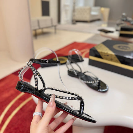 CHRISTIAN LOUBOUTIN 26S STUDDED THONG SANDALS IN BLACK PATENT CALFSKIN
