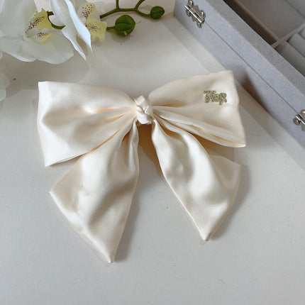 DIOR 26S BOW HAIR CLIP IN WHITE SILK 500721