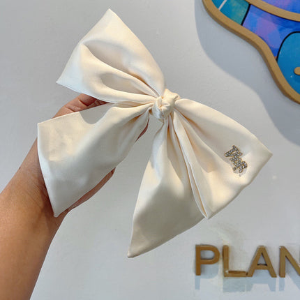 DIOR 26S BOW HAIR CLIP IN WHITE SILK 500721