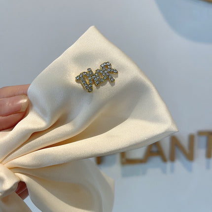 DIOR 26S BOW HAIR CLIP IN WHITE SILK 500721