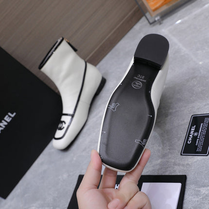 CHANEL 26S ANKLE BOOTS IN WHITE CALFSKIN WITH BLACK PATENT LEATHER TRIM AND CC LOGO ON TOE CAP