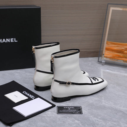 CHANEL 26S ANKLE BOOTS IN WHITE CALFSKIN WITH BLACK PATENT LEATHER TRIM AND CC LOGO ON TOE CAP