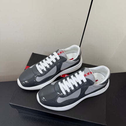 PRADA 26S SNEAKERS IN GRAY PATENT CALFSKIN AND WHITE MESH