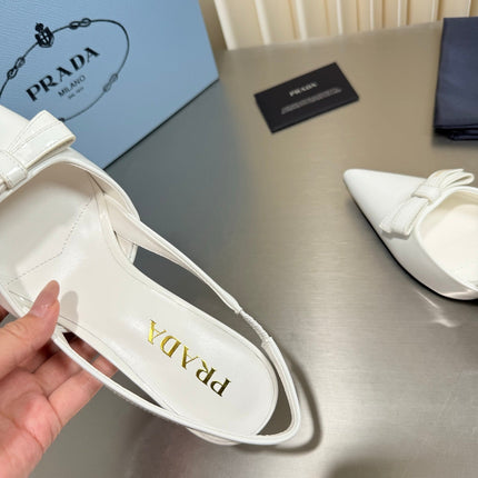 PRADA 26S POINTED-TOE SLINGBACK PUMPS IN WHITE PATENT CALFSKIN WITH BOW