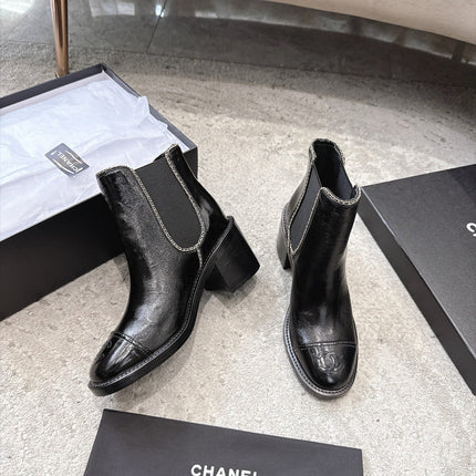 CHANEL 26S CAP TOE CHELSEA ANKLE BOOTS 65MM IN BLACK CRINKLED CALFSKIN WITH CHAIN TRIM