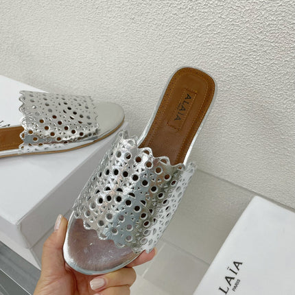 ALAIA VIENNE FLAT MULES IN SILVER LAMBSKIN