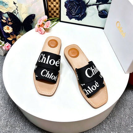 CHLOE 26S CRISSCROSS SLIDES IN BLACK CANVAS