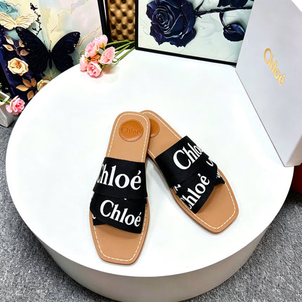 CHLOE 26S CRISSCROSS SLIDES IN BLACK CANVAS