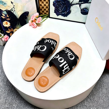 CHLOE 26S CRISSCROSS SLIDES IN BLACK CANVAS