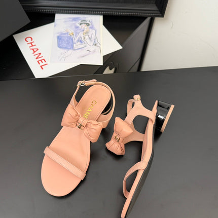 FLAT SANDALS IN PEACHY PINK CALFSKIN WITH BOW