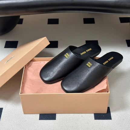 MIUMIU 26S MULE LOAFERS IN BLACK CALSKIN