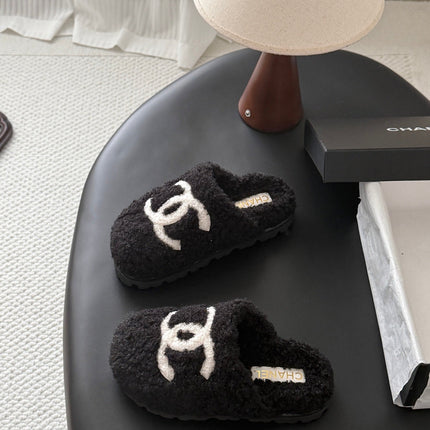 CHANEL 26S SLIDE SANDALS IN BLACK SHEARLING UPPER AND LINING WITH WHITE CC LOGO