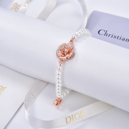 CD 26S PEARL FLOWER CHARM BRACELET IN ROSE GOLD TONE METAL 631860