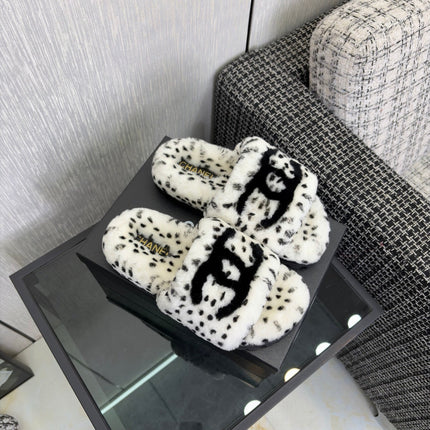 CHANEL 26S PLATFORM SLIDE SANDALS IN WHITE AND BLACK SHEARLING DALMATIAN PRINT