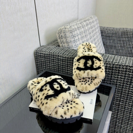 CHANEL 26S PLATFORM SLIDE SANDALS IN BEIGE AND BLACK SHEARLING DALMATIAN PRINT