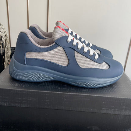 PRADA 26S AMERICA CUP SNEAKERS IN SLATE BLUE SOFT RUBBER AND BIKE FABRIC