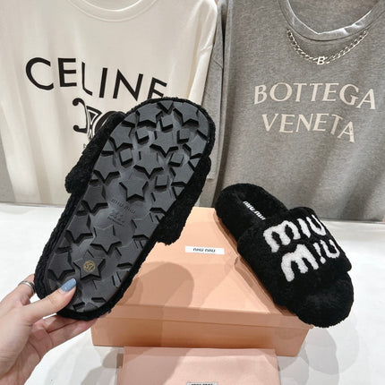 MIUMIU 26S SANDALS IN BLACK SHEARLING WITH LOGO LETTERING