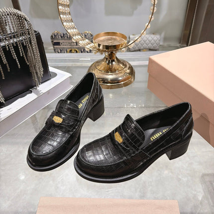 MIUMIU 26S BLOCK HEEL LOAFERS 55MM IN BLACK CROCODILE EMBOSSED CALFSKIN GOLD HARDWARE
